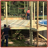 Men Working on a Wooden Deck Pool